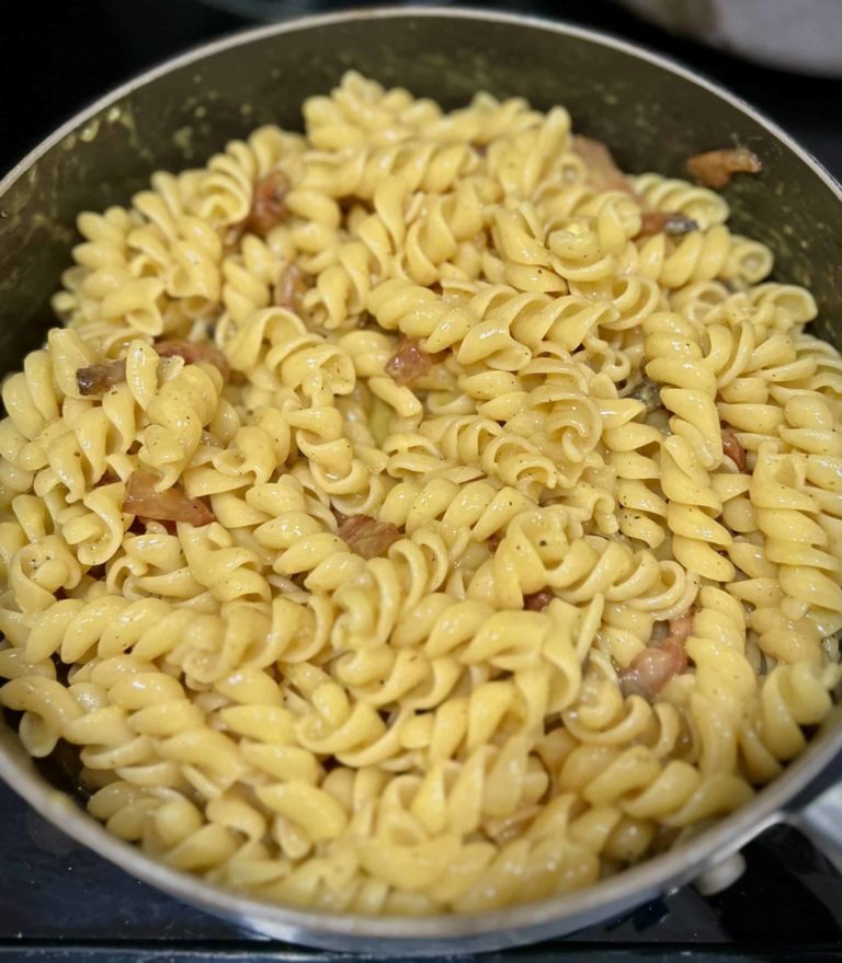 Carbonara on the skillet being tossed