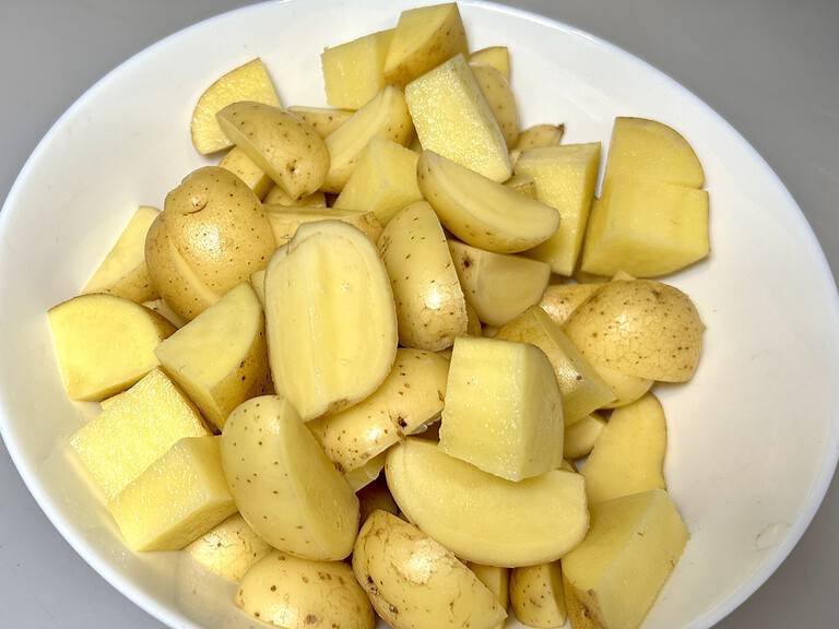 Quartered potatoes ready to go on the griddle