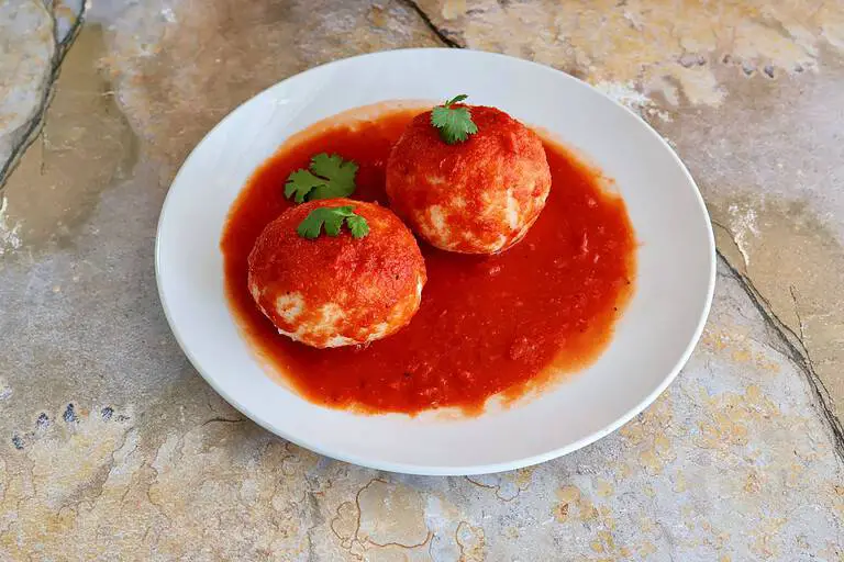 Served Bollos Pelones with the sauce and cilantro